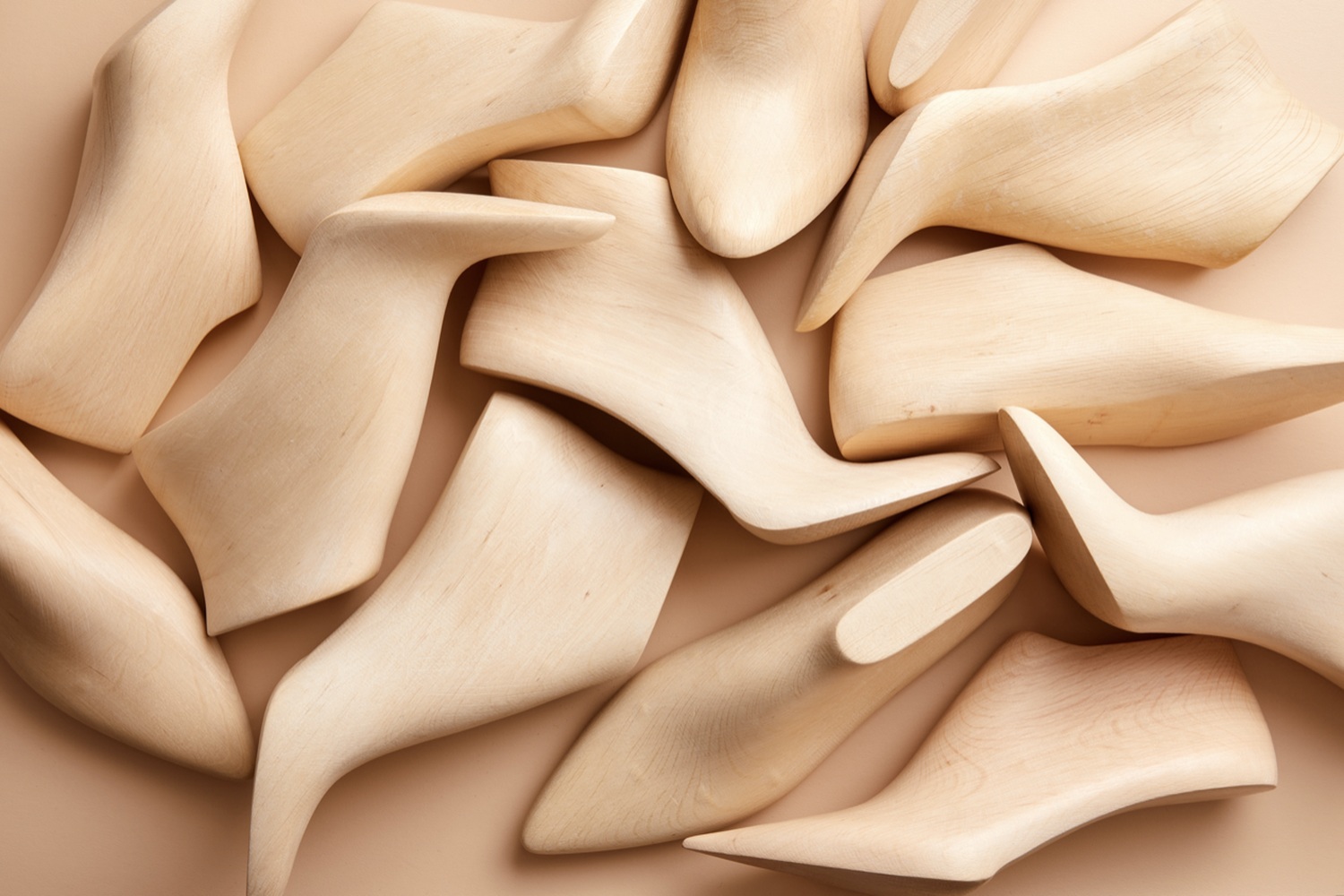 Sculptural wooden shoe lasts in pale peach Sirolo tones